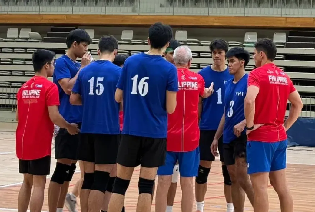 Members of the Alas Pilipinas Men huddle around Italian head coach Angiolino Frigoni in training camp at the Santo Tirso Sports Facility in Portugal.