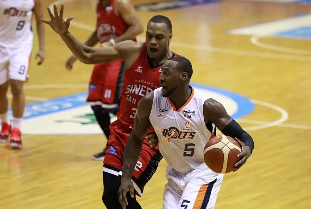 Allen Durham tries to score against Justin Brownlee